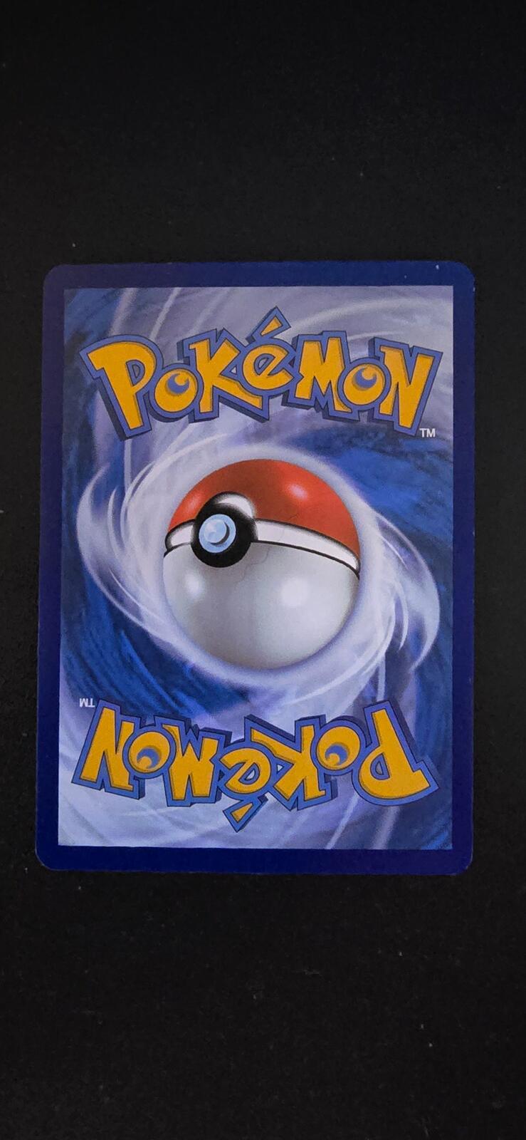 Appletun Pokémon trading card from Surging Sparks