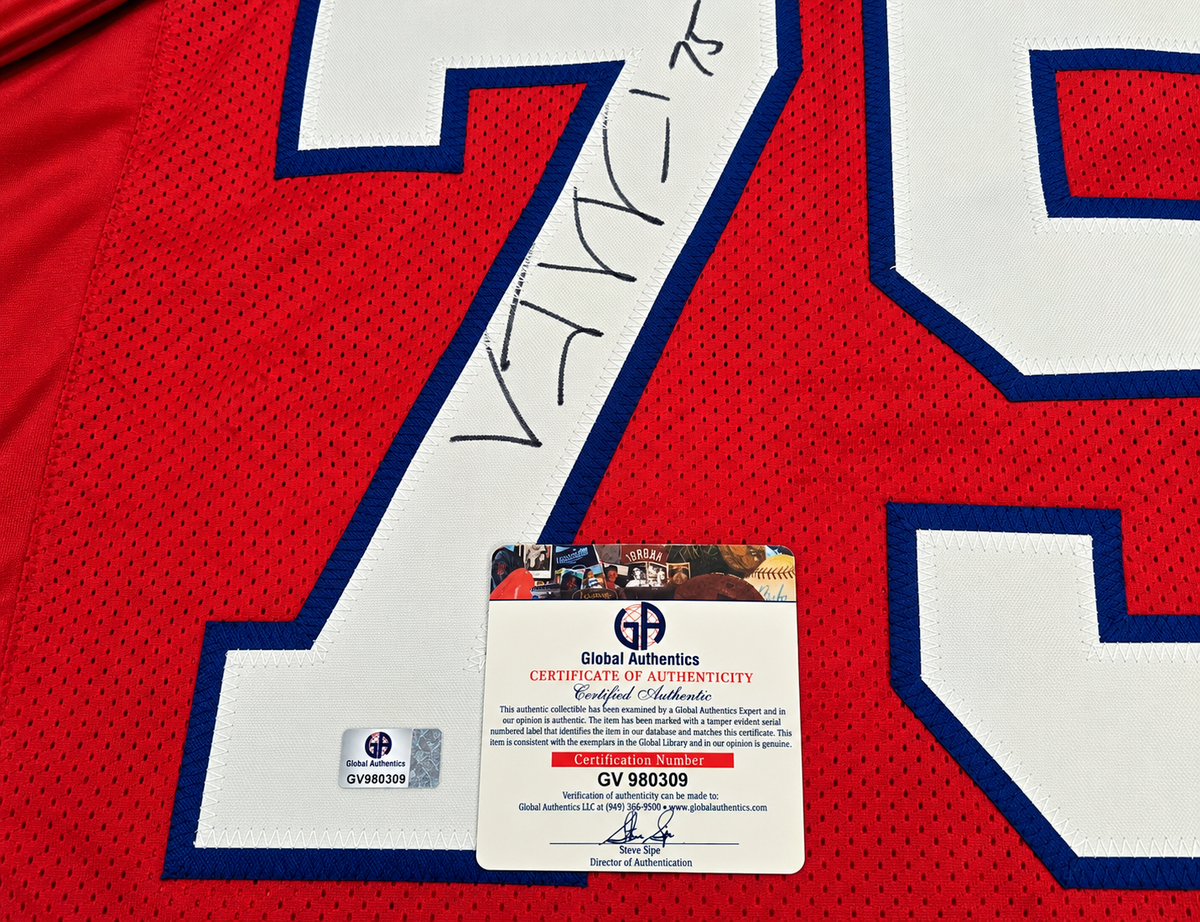 Close-up of Vince Wilfork signature on red number 75 jersey with Global Authentics COA and matching hologram GV980309