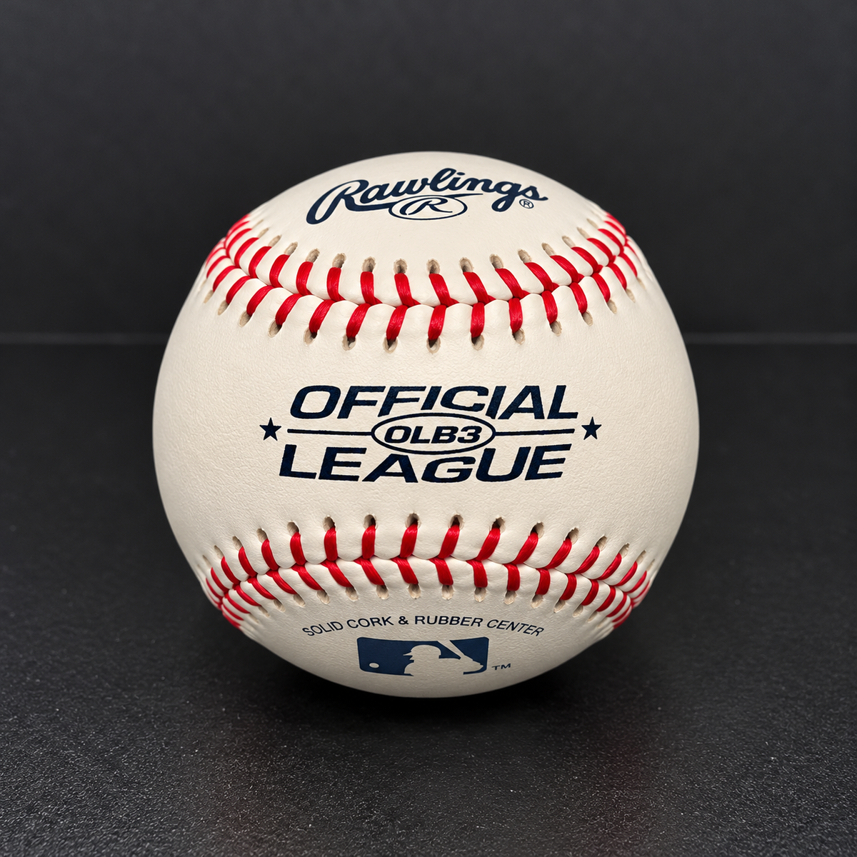 Reverse side of Rawlings Official OLB3 League baseball showing printed markings and red stitching
