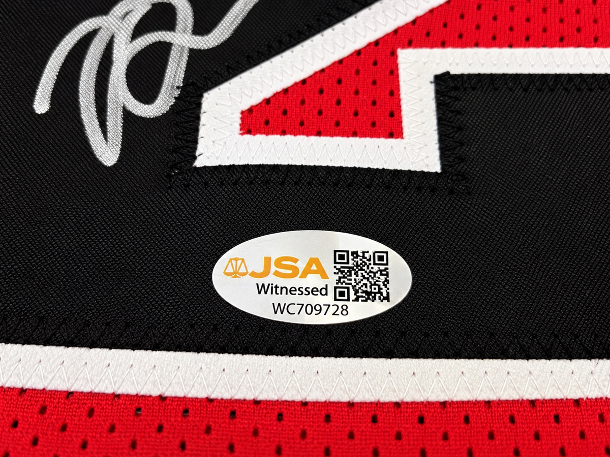 Close-up of JSA Witnessed authentication hologram WC709728 on Brian Scalabrine signed Chicago Bulls jersey