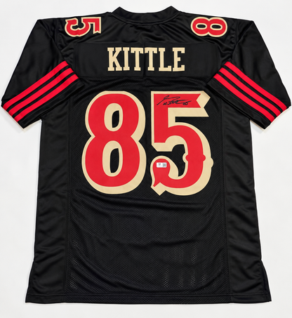 Back of George Kittle autographed black San Francisco 49ers-style number 85 jersey showing signature and authentication sticker