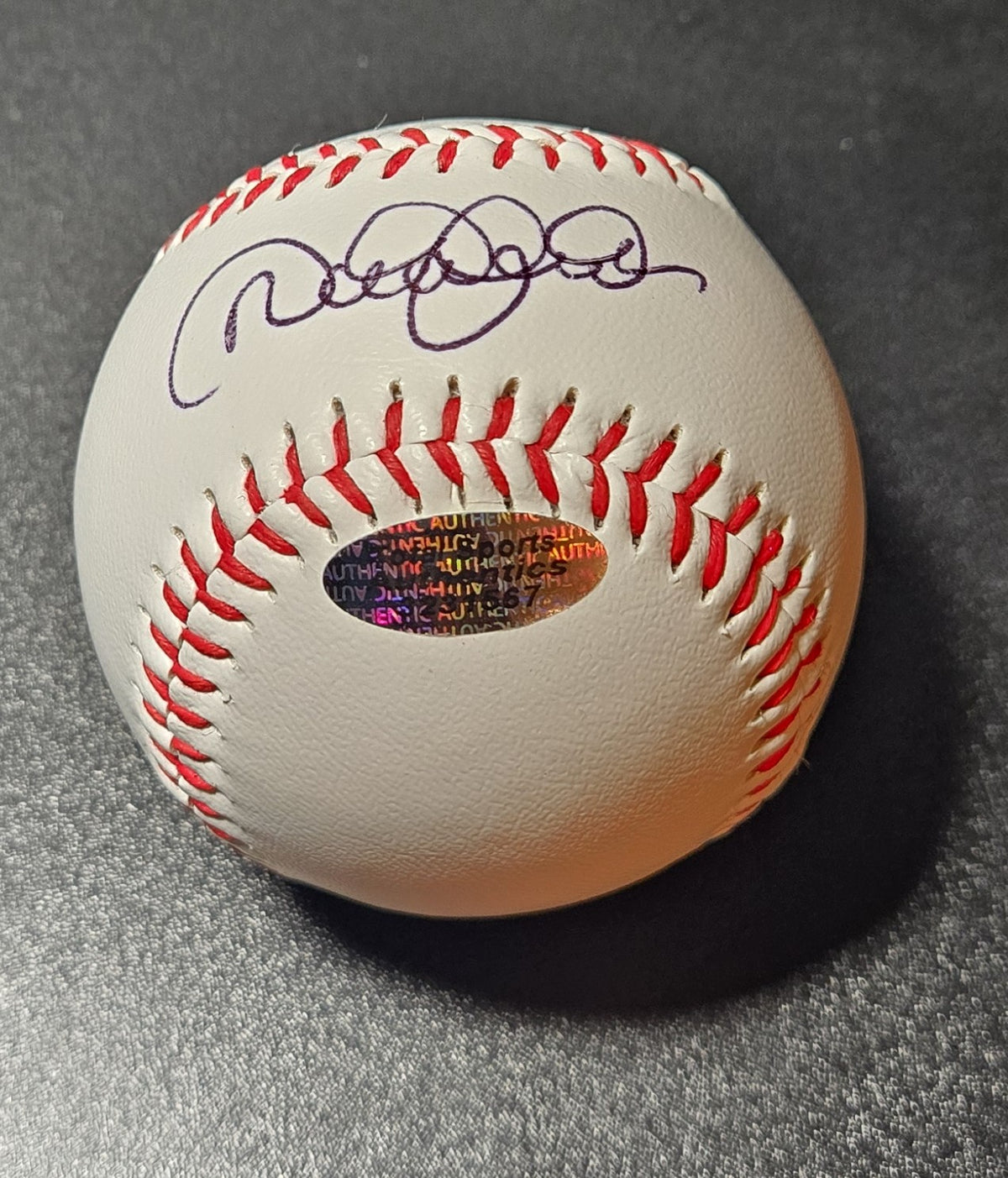 Derek Jeter autographed baseball showing blue-purple ink signature and oval Total Sports authentication hologram