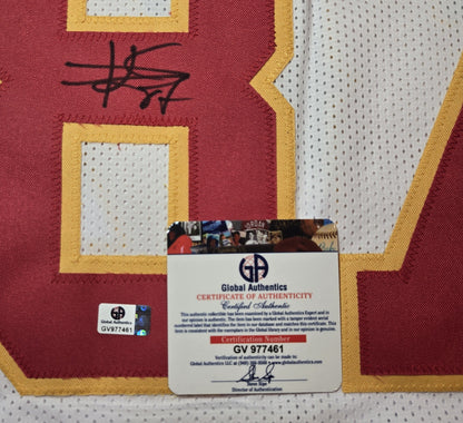 Authentication documentation photo for Travis Kelce signed Chiefs-style number 87 football jersey