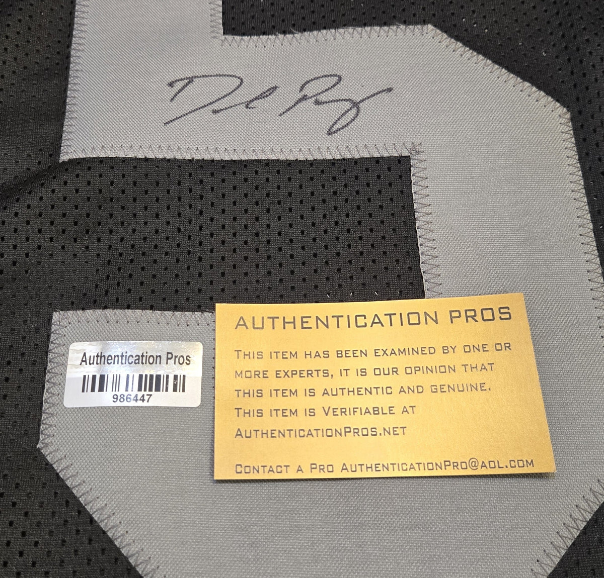 Authentication documentation close-up for Denzel Perryman signed Raiders-style number 52 jersey, Authentication Pros 986447